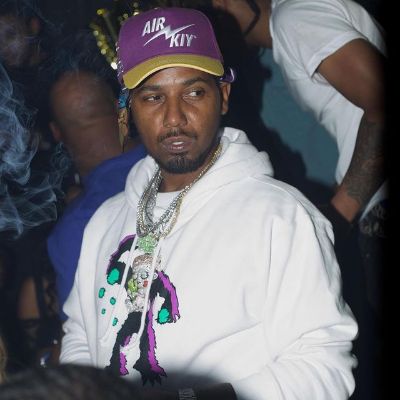 Juelz is wearing a white hoodie with purple cap.
